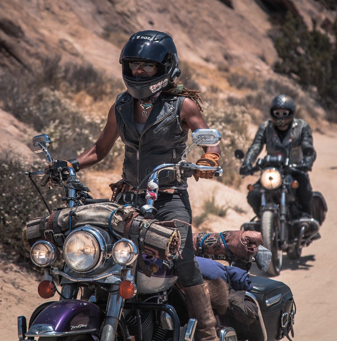 Gevin riding through a canyon in helmet and goggles