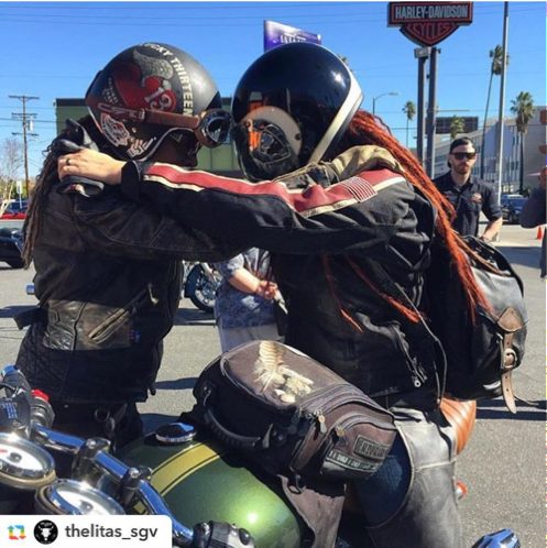 Gevin embracing a friend, both in riding gear