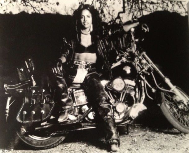 Gevin on her motorcycle, vintage black-and-white photo